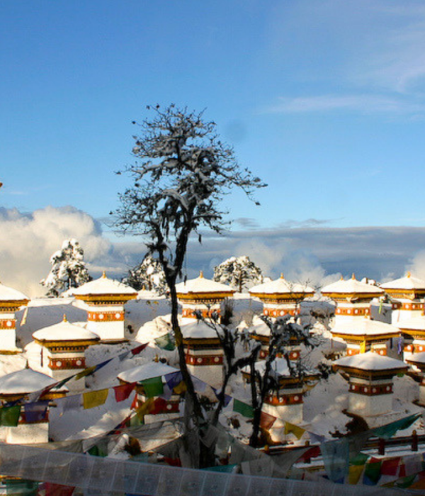 A winter sanctuary in the clouds. Standing at 3,100 meters, the 108 sacred chortens of Dochula Pass sit blanketed in snow, offering a breathtaking intersection of Bhutan’s dramatic alpine landscape and its deeply rooted spiritual heritage.